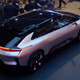 VIPs and employees pose with Faraday Future’s long awaited FF 91 at CES. Adams is not in the photo. Photo Credit: Raphael Orlove
